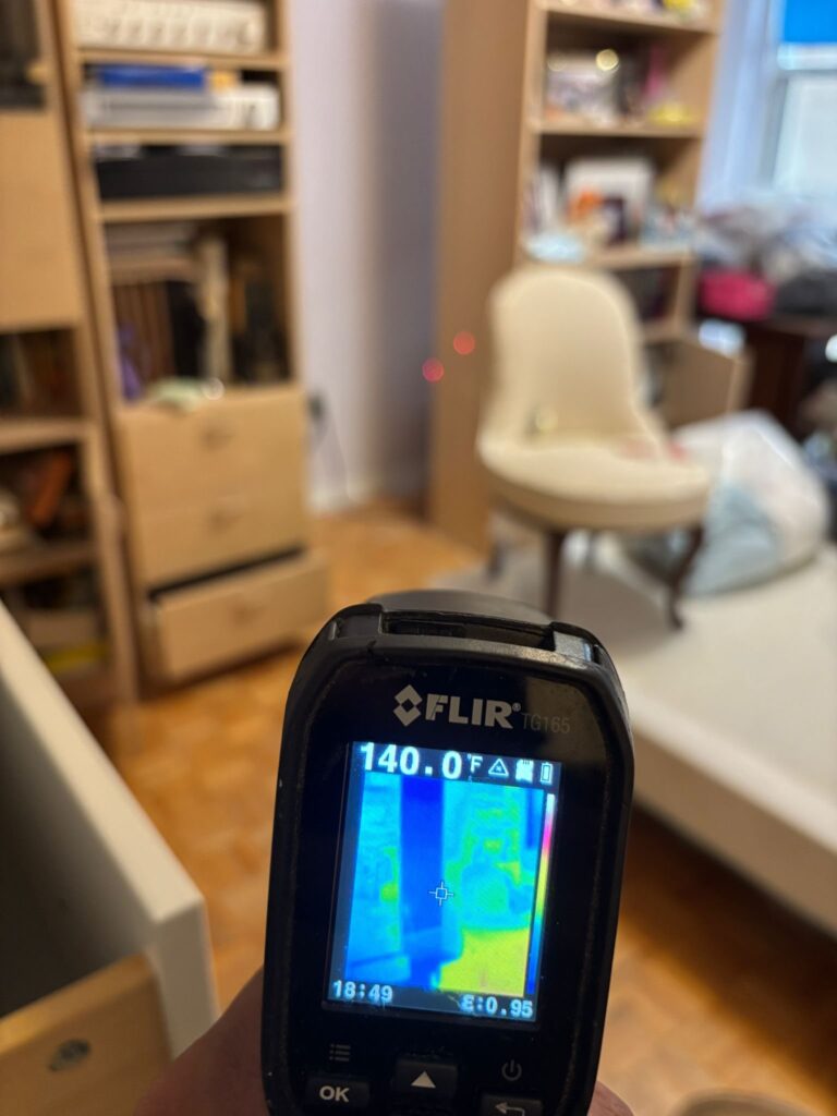 Thermal imaging camera reading 140 degrees Fahrenheit during a Toronto bed bug heat treatment