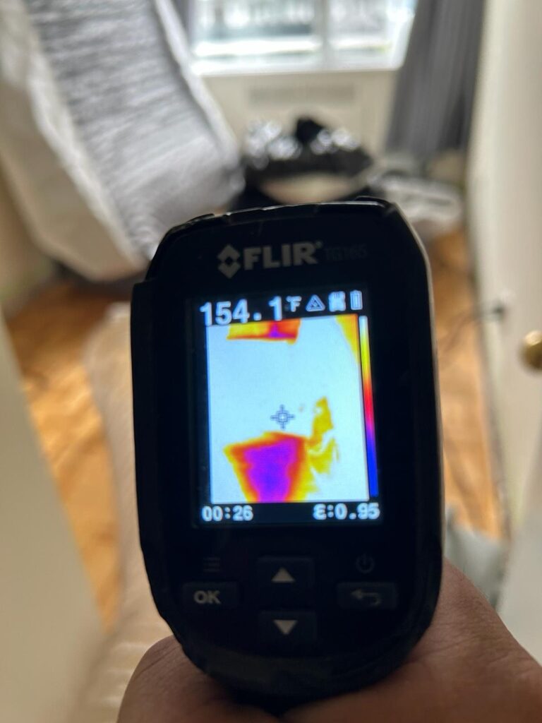 Thermal imaging camera reading 154.1 degrees Fahrenheit during a Toronto bed bug heat treatment